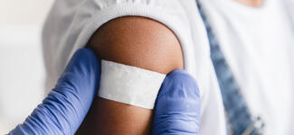 Putting a Bandage Post Vaccination