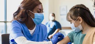 A child receiving their vaccine