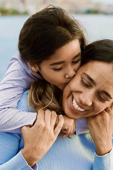 A mother and daughter explore the outdoors.