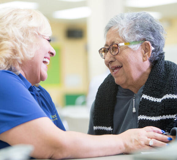 Nurse and elder woman in PACE clinic
